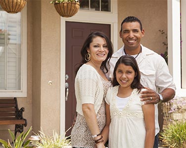 A happy family moving into their new home.